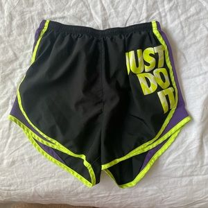 Neon green and purple black Nike shorts